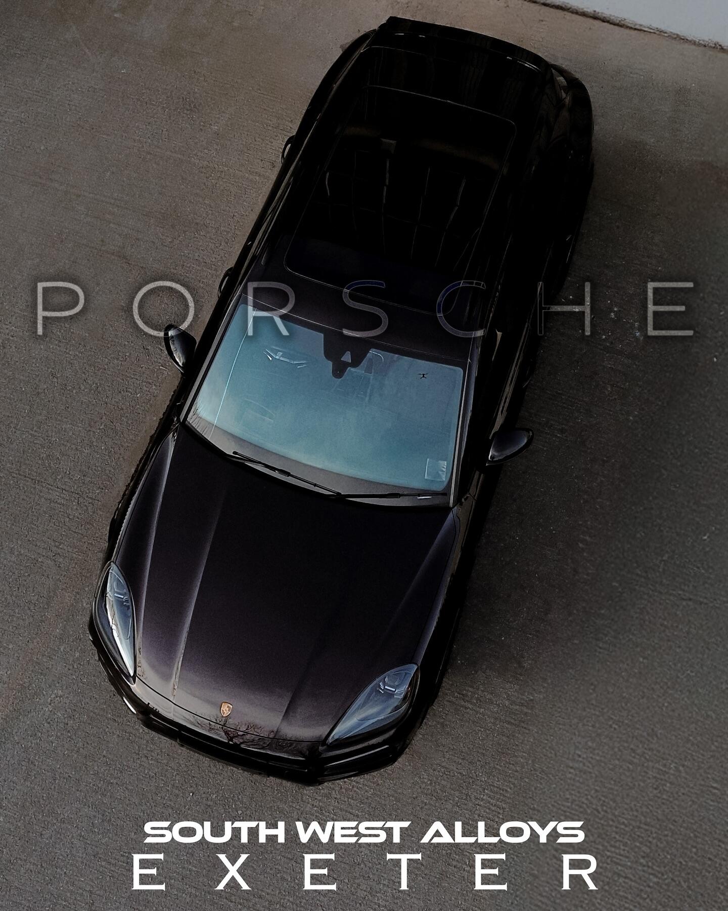 Porsche aerial view with gloss black alloy wheels