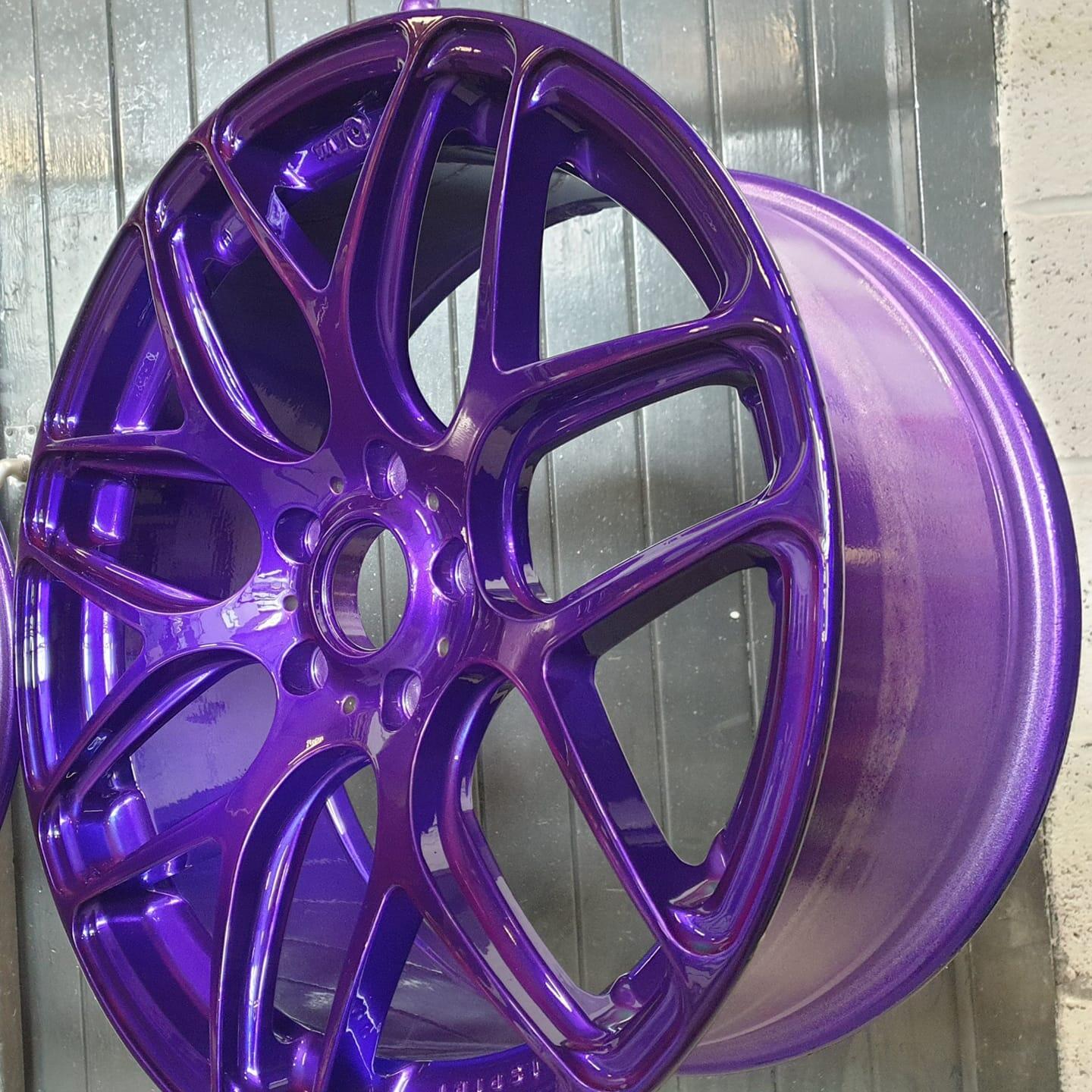 Alloy wheel with custom purple powder coat finish — South West Alloys Exeter powder coating service