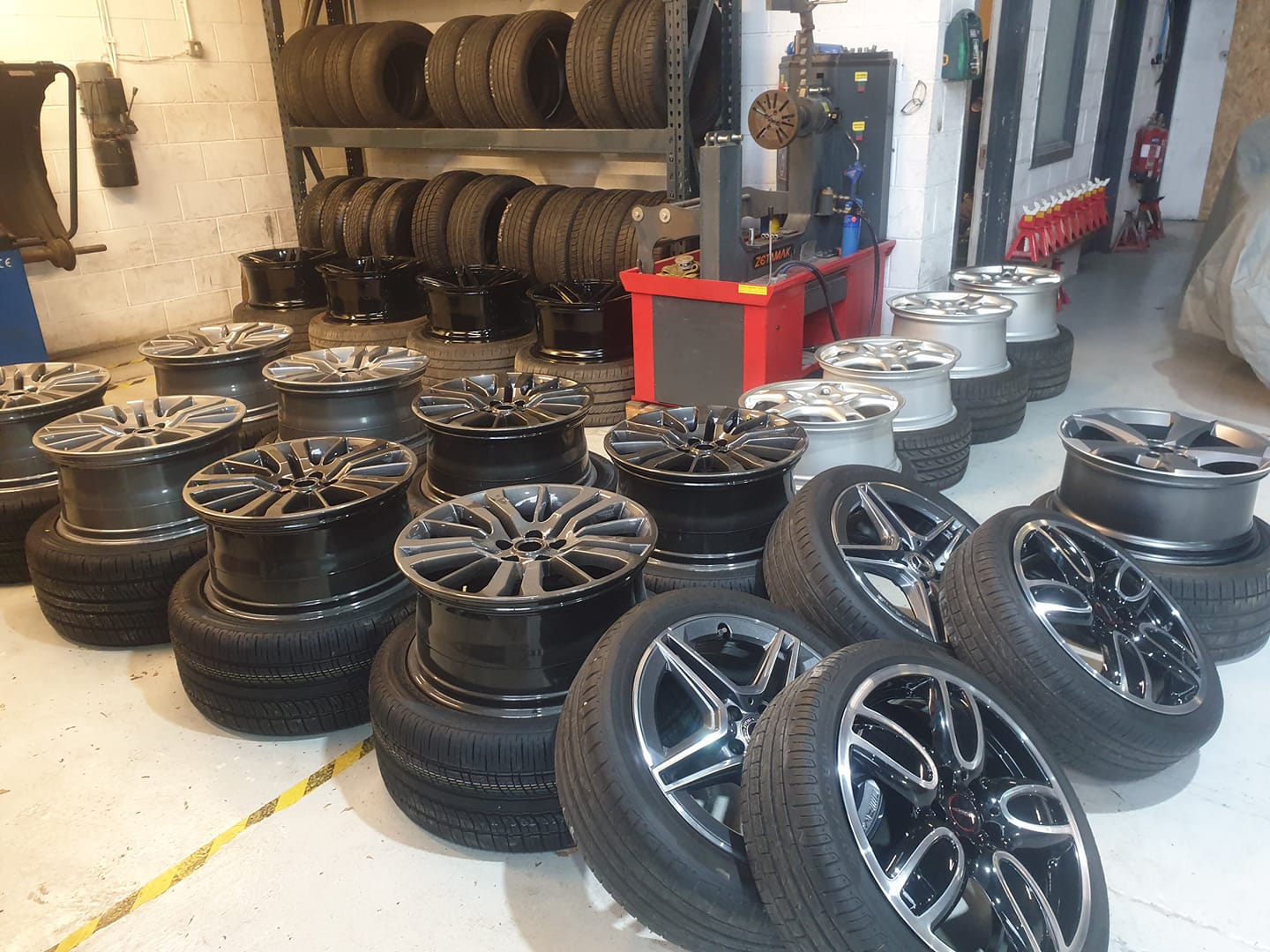 Alloy wheels being prepared for refurbishment in the South West Alloys workshop